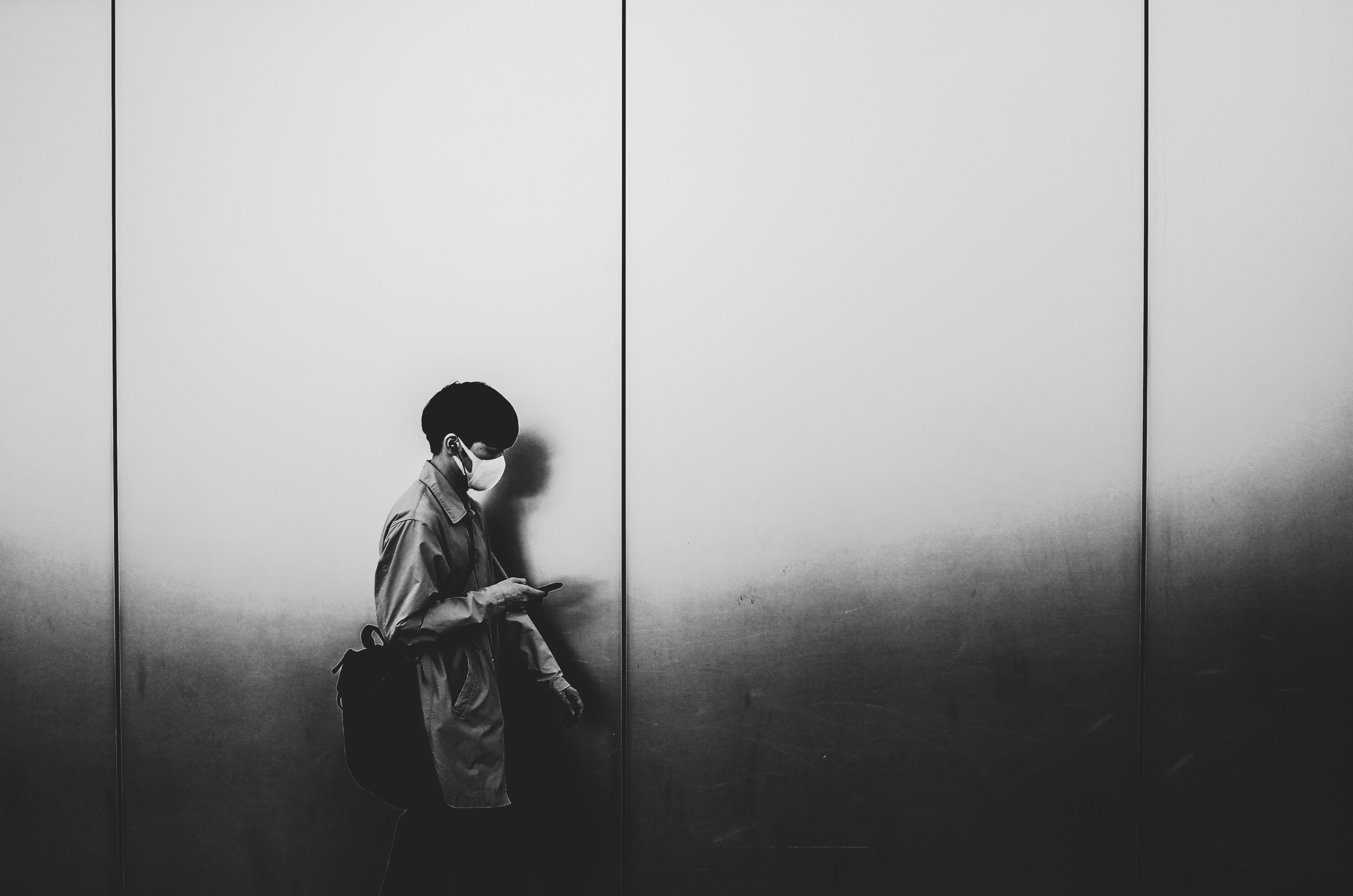 people walk past walls