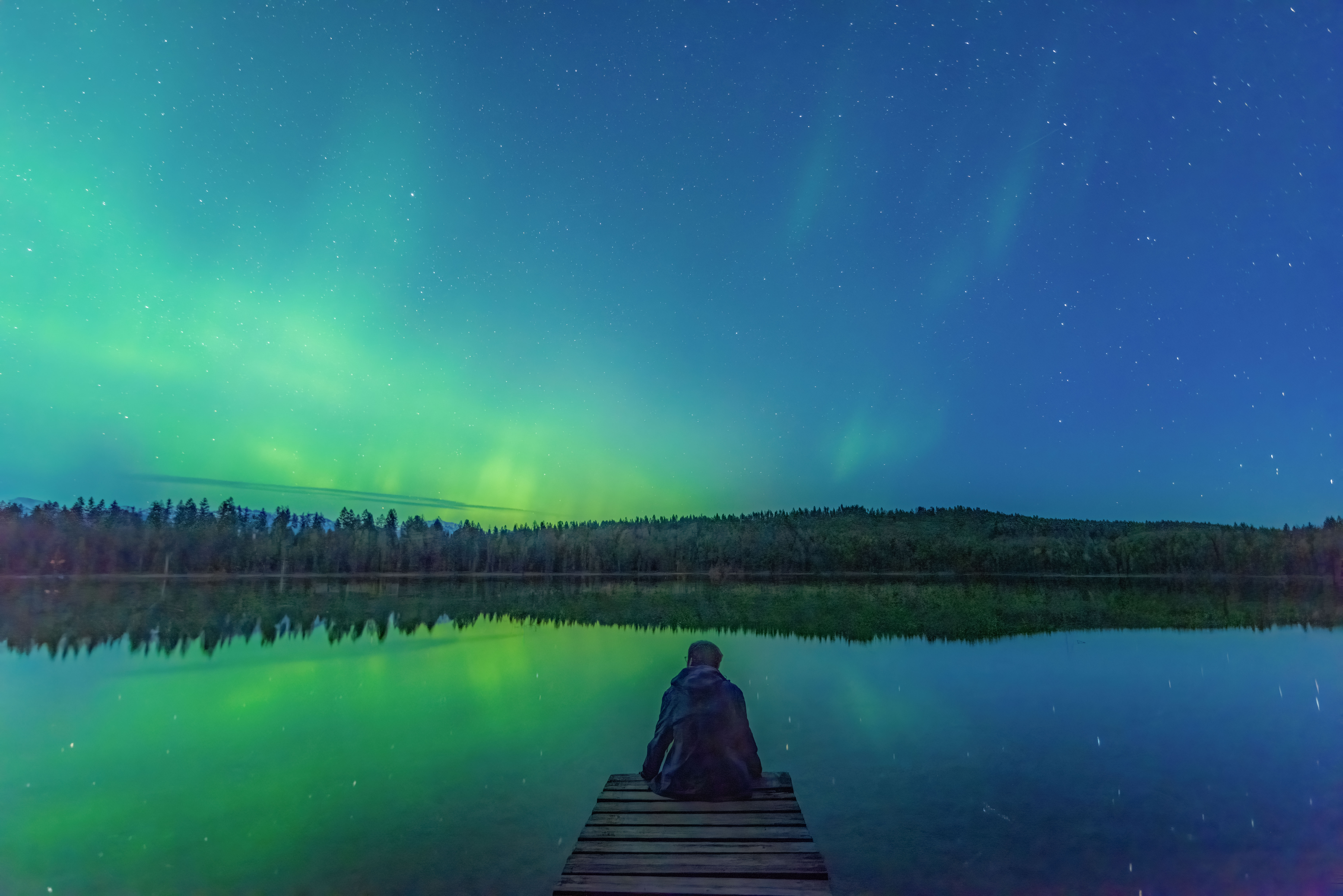 sitting on a dock on the bay