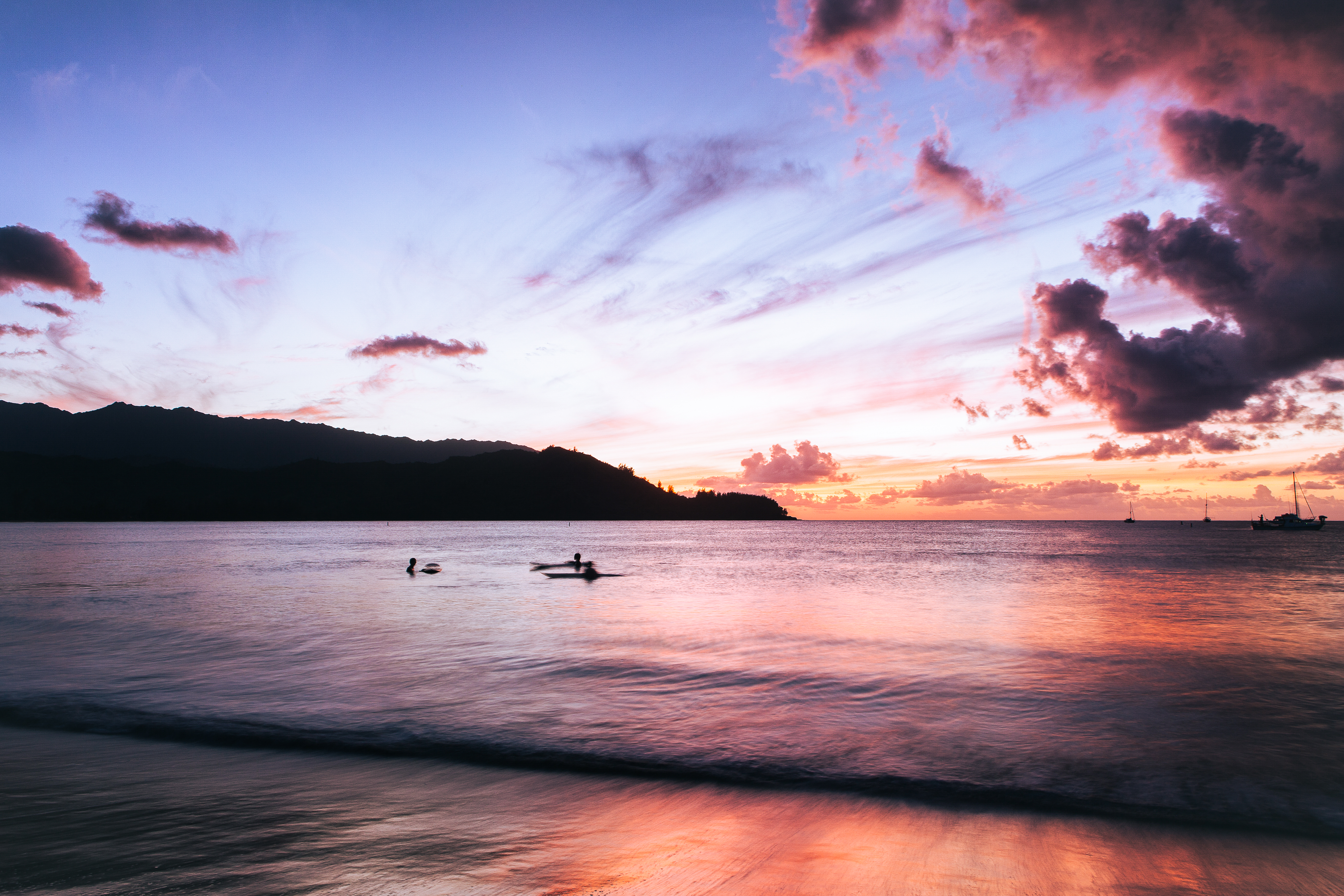 3 Surfers in Hanalei Bay