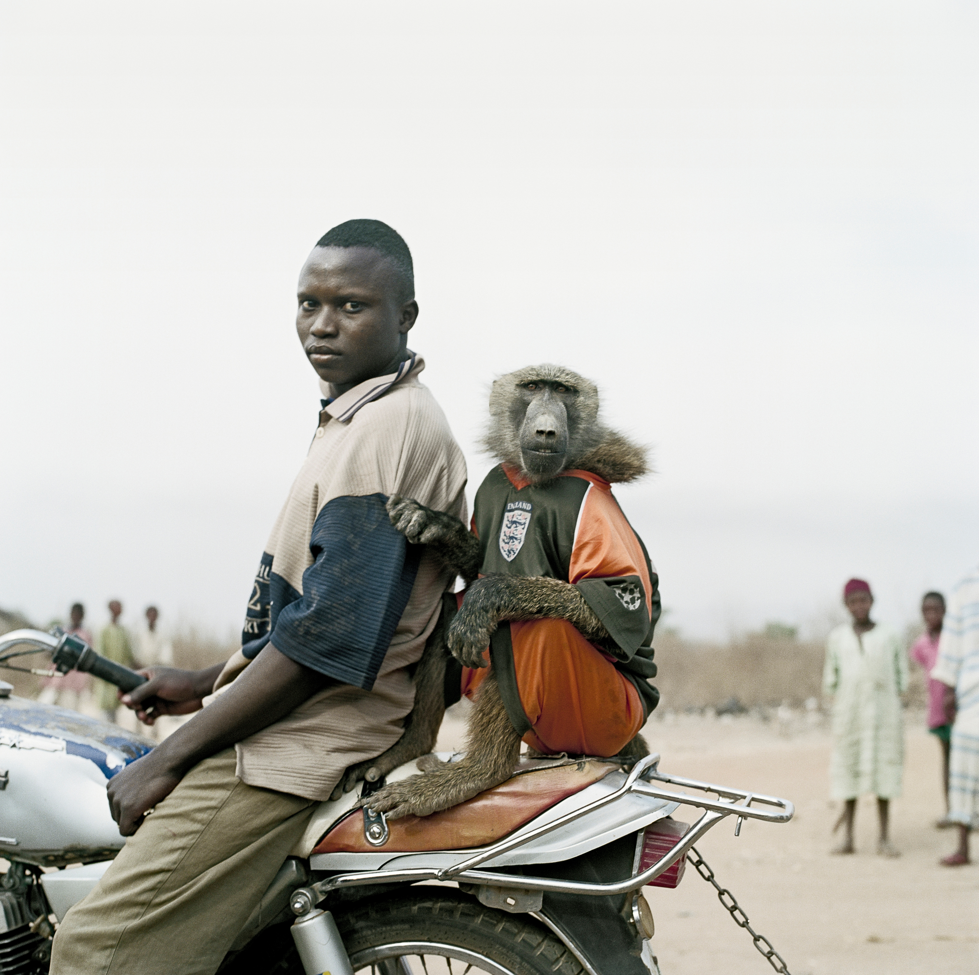 Motorbike rider with Amiloo, Abuja, Nigeria, 2005